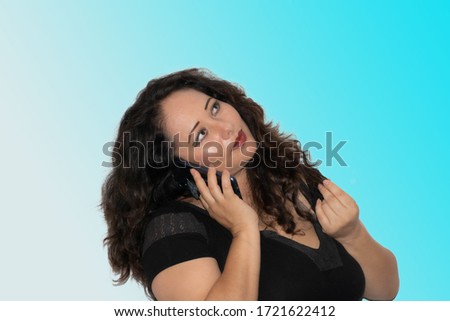 Latin women with long dark hair calling with her cellphone and making picture 