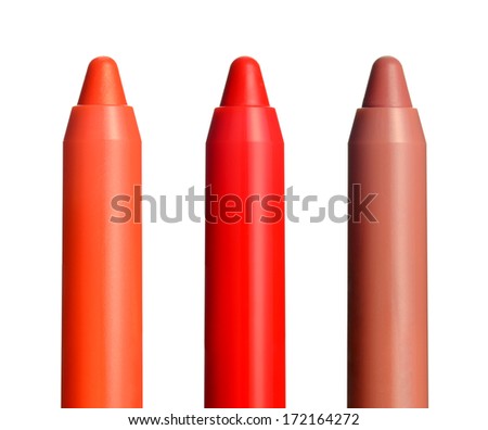 Close-up of few chubby sticks on white background. Moisturizing lip color balm in a crayon. Royalty-Free Stock Photo #172164272