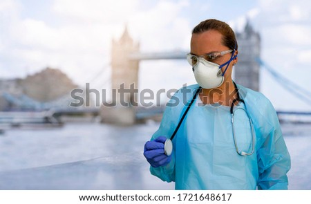 British nurse with protective mask in front of coronavirus pandemia