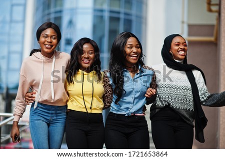 Four young college african american woman friends spend time together. Royalty-Free Stock Photo #1721653864