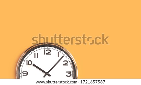 Time concept. Top part of white wall clock face on pastel saffron orange background flat lay. Close up copy space, time management or opening hours. Summer or winter daylight saving time change banner Royalty-Free Stock Photo #1721657587