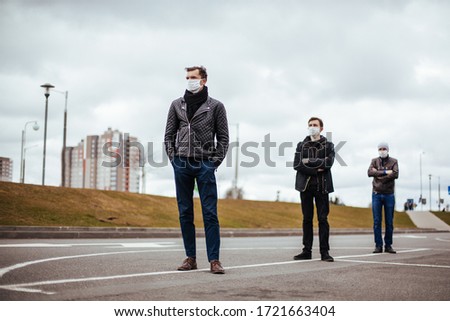 group of people standing in line at a safe distance