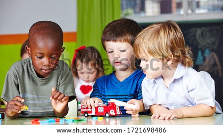 Children play together with a fire brigade in kindergarten Royalty-Free Stock Photo #1721698486