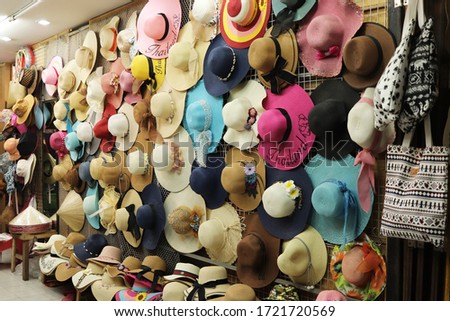 Various hats being sold at a market store in Koh Samui, Thailand. 