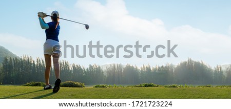 Golfer sport course golf ball fairway. People lifestyle woman playing game golf tee of on the green grass sunset background. Asia female player game shot in summer. copy space banner
