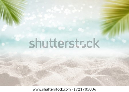 Tropical sea sand sun and white sand floor with palm leaves as frame Montage Summer background concept