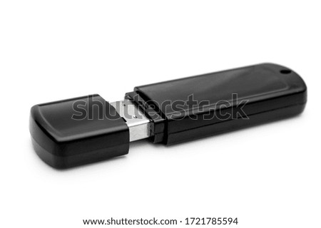 Black flash drive on white background.