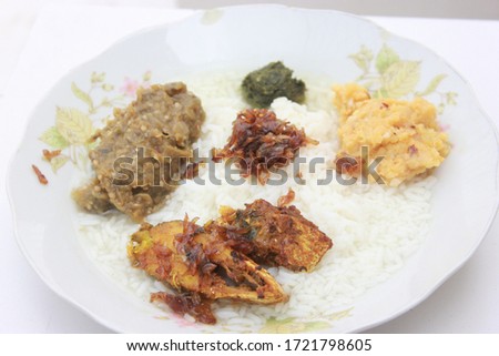Traditional Baisakhi food platter, Hilsa rice and mash potato, mash eggplant