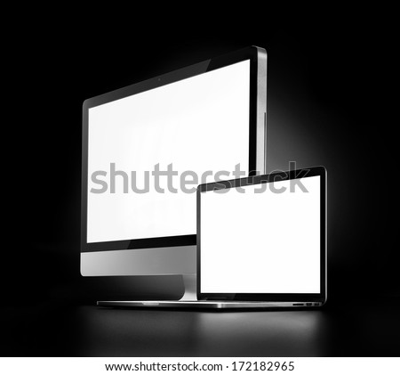 two computers with white screen on a dark background