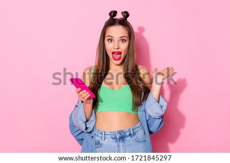 Portrait of crazy astonished funky teen girl use smartphone impressed social media followers subscribers scream wow omg wear green trend shine outfit isolated over pastel color background
