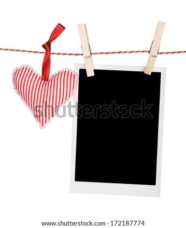 Blank instant photo and red heart hanging. Isolated on white background