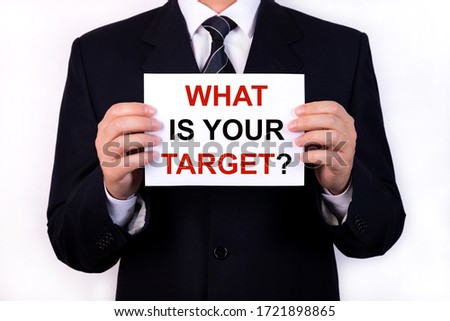 Who is your Target Businessman holding a card with a message text written on it.