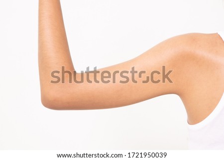 woman grabbing skin on her upper arm with the drawing arrows, Lose weight and liposuction cellulite removal concept, Isolated on white background. Royalty-Free Stock Photo #1721950039