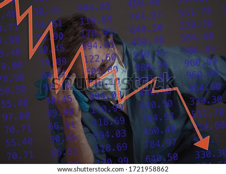 Strong image of overwhelmed man with markek economic graphic COVID-19 Health crisis and economic recession.