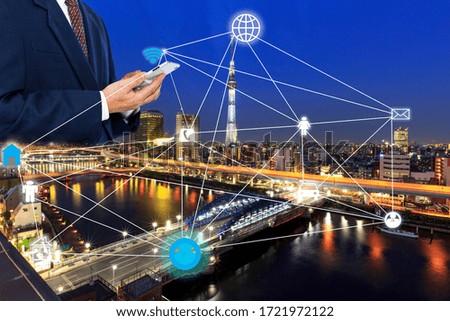 Double exposure businessman use wifi and network  and   skyscraper by Tokyo sky tree  with graphic sensor signal technology concept