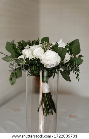 wedding bouquet in a vase,beautiful stylish wedding bouquet with beautiful flowers,floristry of a wedding bouquet,the bride's bouquet