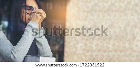 Prayer concept. Asian woman praying, hope for peace and free from coronavirus, Hand in hand together by female, believes and faith in christian religion at church-panoramic banner for web header