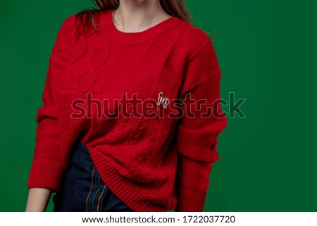 bright green background with space for text. on the left, a girl in a sweater advertises clothing and fashion trends. modern style, promotions and discounts on clothing.