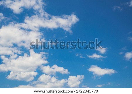 Blue sky with marshmallow clouds