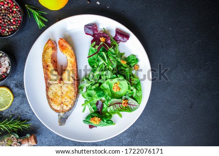pink salmon steak fried and salad,
grilled seafood, pescatarian Menu concept food background keto or paleo diet. top view. copy space for text