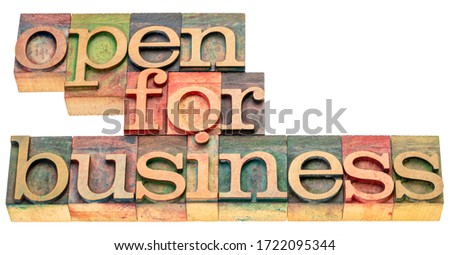 open for business - isolated word abstract in letterpress wood type stained by color inks, business operation during coronavirus pandemic concept