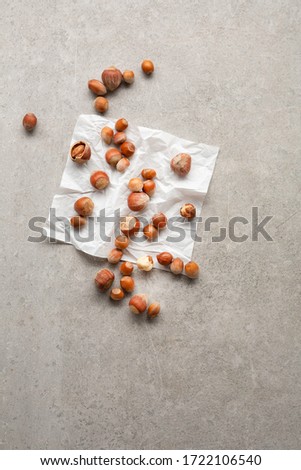 Hazelnuts, filbert on gray surface, healthy food