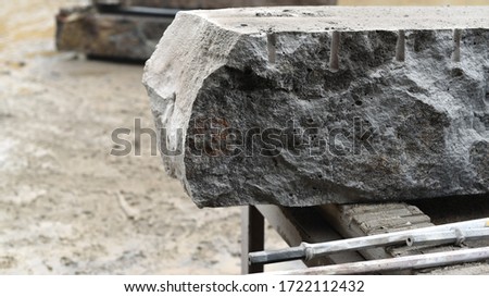 Australian Melbourne quarry rocks stone construction cutting drilling craft machine texture handmade  Royalty-Free Stock Photo #1722112432