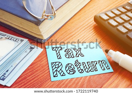 Tax Return is shown on the conceptual business photo