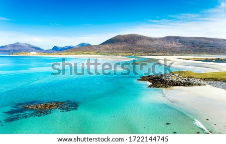 A beautiful sunny morning looking out over the sandy beaches to Luskentyre from Seilebost on the Isle of Harris in the Outer Hebrides of Scotland Royalty-Free Stock Photo #1722144745