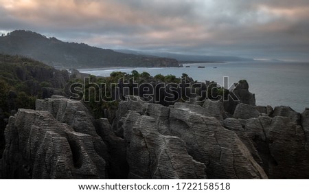 Unusual rock formations on ocean´s coast shot during sunrise, Pictures made at Punakaiki Pancake Rocks, West Coast, New Zealand