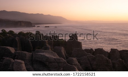 Unusual rock formations on ocean´s coast shot during sunset, Pictures made at Punakaiki Pancake Rocks, West Coast, New Zealand