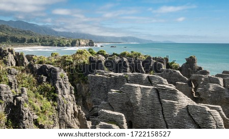 Unusual rock formations on ocean´s coast shot during sunny day, Pictures made at Punakaiki Pancake Rocks, West Coast, New Zealand