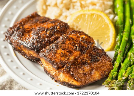 Homemade Blackened Mahimahi White Fish with Asparagus and Rice Royalty-Free Stock Photo #1722170104