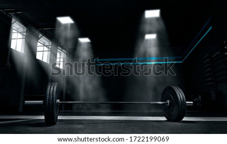 Image of barbell in the gym. The concept of sport and healthy lifestyle.