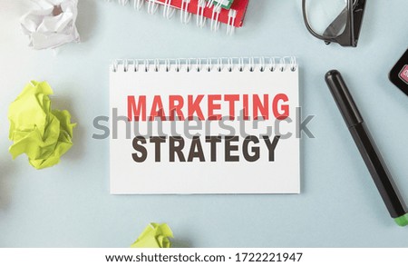 Text on notepad MARKETING STRATEGY. Business Concept