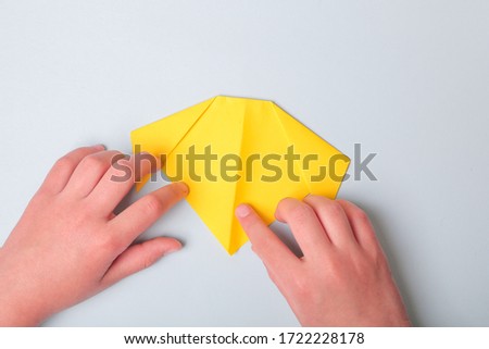 Step by step photo instruction. How to make origami paper dog. DIY for children. Children's art project craft for kids