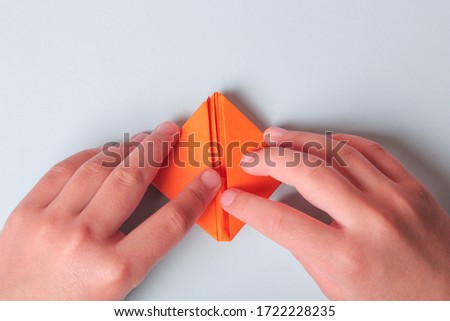 Step by step photo instruction. How to make origami paper boat. DIY for children. Children's art project craft for kids