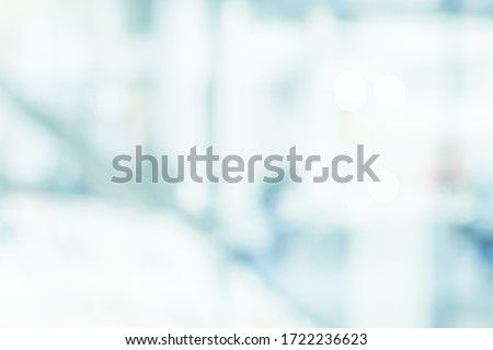 BLURRED OFFICE BACKGROUND, LIGHT BUSINESS HALL, WHITE AND BLUE DEFOCUSED INTERIOR, MEDICAL BACKDROP