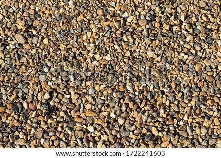 View from above. Background natural gray granite crushed stone, macadam. Macro photo of texture of broken stone or rubble with place for text