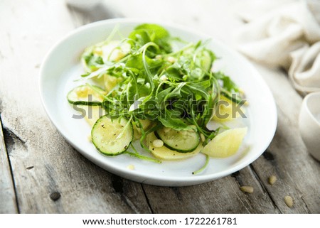 Arugula salad with potato and cucumber