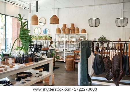 Interior of a stylish boutique full of an assortment of housewares, bags and accessories for sale Royalty-Free Stock Photo #1722273808