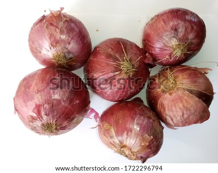 Red onions (allium cepa) close up picture on white background 