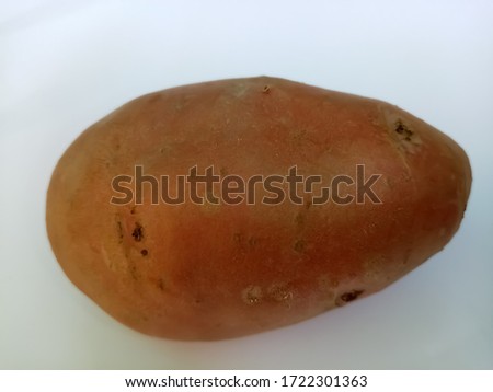Red potato closeup picture on white background 