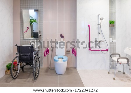 Interior of bathroom for the disabled or elderly people. Handrail for disabled and elderly people in the bathroom