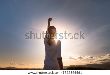 Never give up. Woman with fist up feeling strong, powerful and determined.  Royalty-Free Stock Photo #1722346561