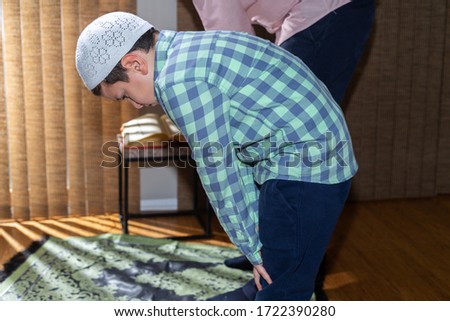 Family praying together in Ramadan	
