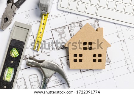 Architect workplace top view. Architectural project, blueprints, blueprint rolls on table. Construction background. Engineering tools. Copy space Royalty-Free Stock Photo #1722391774