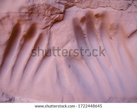 Two sets of hand prints are carved into the soft Navajo sandstone in Escalante National Monument, Utah. Folklore states these were carved by birthing native women but these may actually be modern.