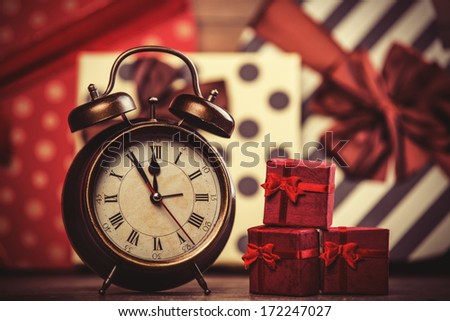 Vintage clock on christmas background. Photo in retro color image style.