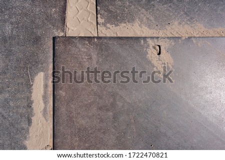 Steel plate as a drive plate or drive-over plates rusted, scratched and dirty when used on construction site as background with different designs